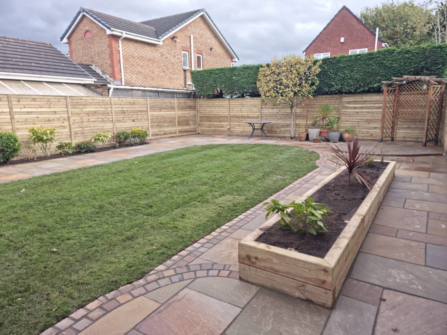 Indian stone paving with lawn space